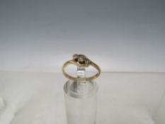 AN 18CT GOLD AND DIAMOND THREE STONE CROSSOVER RING, size N ½, approximately 2.01 g