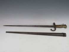 A 19TH CENTURY FRENCH BAYONET, in metal scabbard, inscribed on top edge of blade and dated 186,