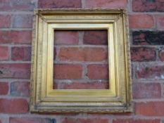 A 19TH CENTURY GOLD FRAME WITH REEDED INNER DESIGN AND ACANTHUS LEAF DESIGN TO OUTER EDGE, with gold
