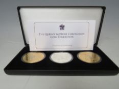 A CASED SET OF JUBILEE MINT THE QUEEN'S SAPPHIRE CORONATION COIN COLLECTION, three coins, with