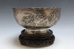 LUENWO SHANGHAI - A CHINESE SILVER BOWL ON STAND, decorated with a floral design, marks to base,