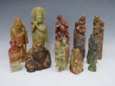 A COLLECTION OF ORIENTAL CARVED SOAPSTONE FIGURES / DEITIES, tallest H 23 cm (13)