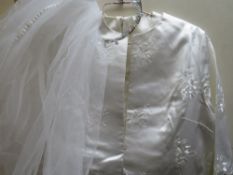 A VINTAGE WHITE SATIN WEDDING DRESS WITH EMBROIDERED COAT, together with a similar turquoise long