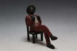 A COLD PAINTED BRONZE FIGURE OF A SEATED DANDY, H 11.5 cm