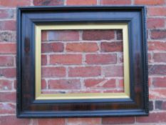 A 19TH CENTURY DUTCH EBONISED FRAME WITH GOLD SLIP, frame W 11 cm, slip rebate 59 x 46 cm, frame