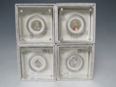 A SET OF FOUR ROYAL MINT BEATRIX POTTER SILVER 50 PENCE COINS, comprising Peter Rabbit, Flopsy