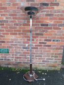 AN ART DECO CHROME AND ROSEWOOD? STANDARD LAMP / UPLIGHTER, the square base supporting an angular