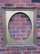A 20TH CENTURY DECORATIVE GOLD SWEPT FRAME WITH OVAL GOLD SPANDREL, frame W 7.5 cm, spandrel site