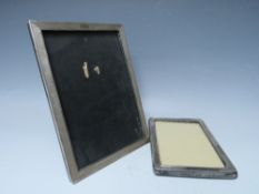 A HALLMARKED SILVER EASEL BACK PICTURE FRAME, rebate 20 x 13 cm, together with a smaller