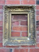 A LATE 18TH / EARLY 19TH CENTURY DECORATIVE GOLD FRAME, with corner embellishments and gold slip, in
