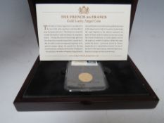 A FRENCH 20 FRANCS GOLD LUCKY ANGEL COIN 1875. with certificate and wooden case