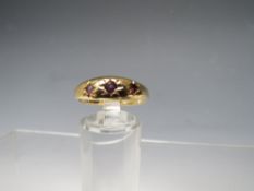 A HALLMARKED 9CT GOLD 3 STONE AMETHYST RING, ring size Q ½, approximate weight 2.1 g