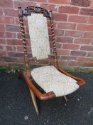 A 19TH CENTURY CARVED BARLEYTWIST FOLDING CHAIR, with modern and floral upholstered detail