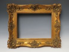 A 19TH CENTURY GOLD SWEPT FRAME, frame W 9 cm, rebate 29 x 39 cm