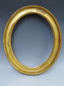 A 19TH CENTURY OVAL GOLD FRAME, frame W 4 cm, rebate 33 x 27 cm