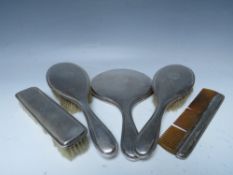 A FIVE PIECE HALLMARKED SILVER BACKED DRESSING TABLE SET, with engraved date and initial to