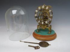 A BRASS CASED SKELETON CLOCK UNDER GLASS DOME, the lyre shaped frame having four spoke gears, single