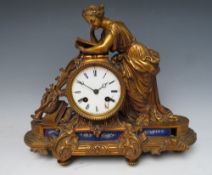 A GILDED BRONZE FEMALE FIGURAL BELL STRIKE MANTLE CLOCK, comprising a neo-classical female draped