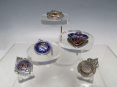 A COLLECTION OF FOUR EARLY 20TH CENTURY HALLMARKED SILVER AND ENAMEL FOOTBALL FOB MEDALS, comprising