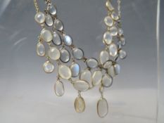 A WHITE METAL AND MOONSTONE TYPE 'DROPPER' NECKLACE, together with a similar gold tone example (2)