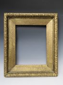A 19TH CENTURY GOLD FRAME, with design to outer edge and gold slip, frame W 4 cm, slip rebate 38.5 x