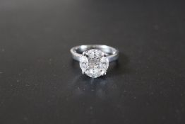 AN 18 CARAT WHITE GOLD 1.72 CARAT MARQUISE AND PRINCESS CUT DIAMOND RING, complete with AGI