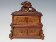 A VINTAGE BLACK FOREST MINIATURE SET OF DRAWERS, with carved bird surmount, H 16 cm, W 14 cm, D 7