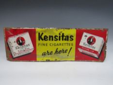 A VINTAGE ENAMELLED METAL ADVERTISING SIGN, for Kensitas fine cigarettes, 17 x 50.5 cm