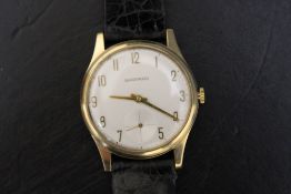 GARRARD - A 9CT GOLD WRIST WATCH, on leather strap, Dia 3.5 cmCondition Report:ticks on winding -