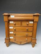 A 20TH CENTURY APPRENTICE CHEST OF DRAWERS IN THE SCOTTISH STYLE, having two short over three