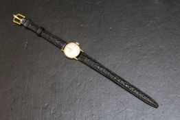 OMEGA - A LADIES 9CT GOLD WRIST WATCH, on replacement leather strap, Dia 2 cmCondition Report:does