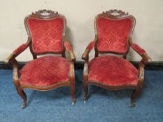 A PAIR OF 19TH CENTURY MAHOGANY CARVED OPEN ARMCHAIRS, in the Louis XV style, original castors