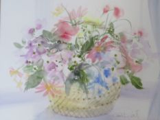 CELIA RUSSELL (b.1900). A still life study of flowers in a basket, signed lower middle to right,