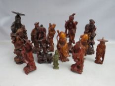 A COLLECTION OF TWELVE ASSORTED CARVED HARDWOOD ORIENTAL FIGURES, tallest H 26.5 cm, examples