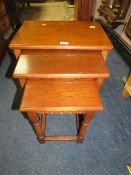 AN OAK NEST OF THREE TABLES