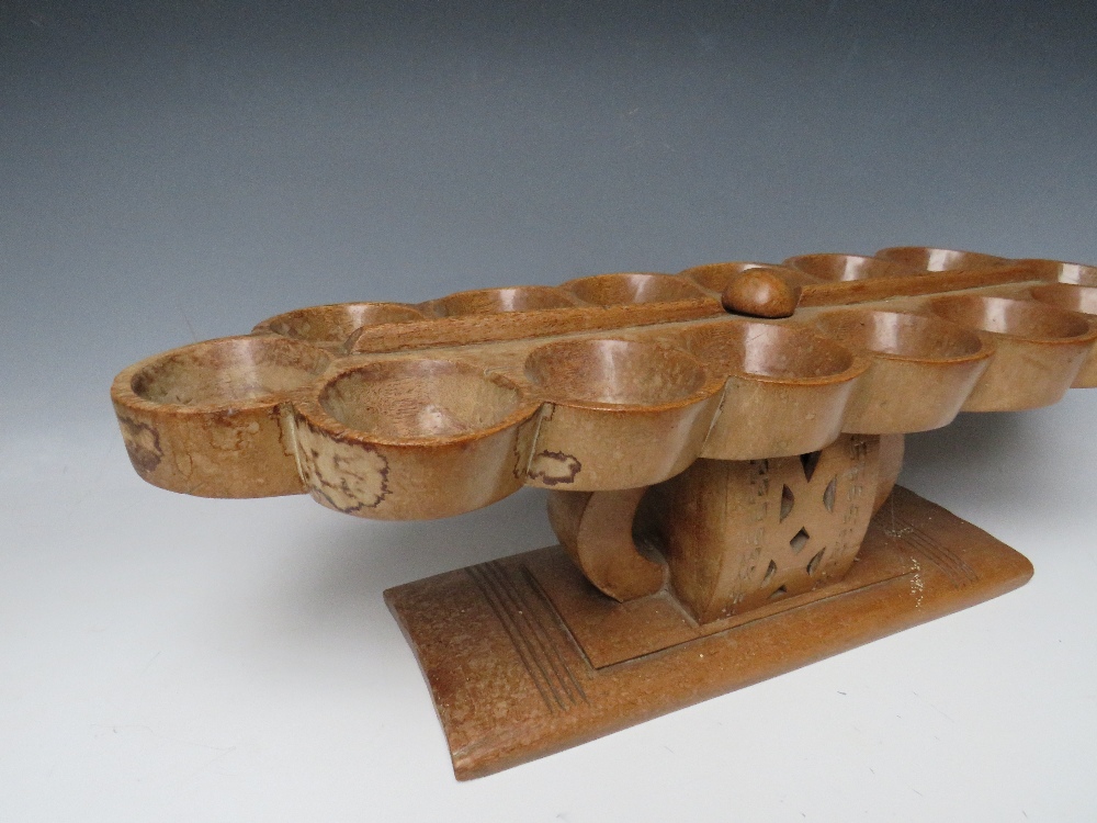 AN AFRICAN TRIBAL ASHANTI 'MANCALA' BEAD GAME BOARD, on a raised stand with pierced decoration, W 68 - Image 4 of 6