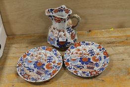 AN ANTIQUE MASONS IRONSTONE JUG TOGETHER WITH TWO PLATES