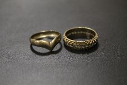 A HALLMARKED 9CT GOLD ETERNITY RING - APPROX WEIGHT 3.6 G, TOGETHER WITH A YELLOW METAL RING (2)