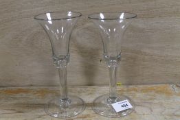 A PAIR OF ANTIQUE WINE GLASSES, both with bubble in stem, H 18.5 cm