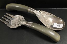 A PAIR OF CONTINENTAL WHITE METAL ORNATE SERVERS WITH HORN HANDLES A/F