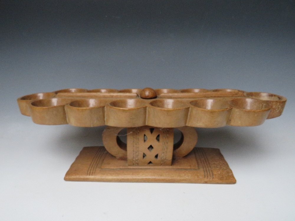 AN AFRICAN TRIBAL ASHANTI 'MANCALA' BEAD GAME BOARD, on a raised stand with pierced decoration, W 68