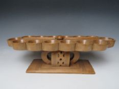 AN AFRICAN TRIBAL ASHANTI 'MANCALA' BEAD GAME BOARD, on a raised stand with pierced decoration, W 68