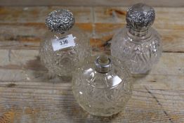 THREE ASSORTED SILVER TOPPED SCENT BOTTLES ALL A/F