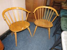 A PAIR OF BLONDE ERCOL STICKBACK ARMCHAIRS