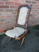 A 19TH CENTURY CARVED BARLEYTWIST FOLDING CHAIR, with modern and floral upholstered detail