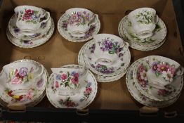 A TRAY OF ROYAL ALBERT FLOWERS OF THE MONTH CUPS AND SAUCERS - MARKED AS SECONDS