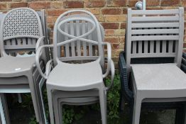A QUANTITY OF 14 HARD PLASTIC STACKING CHAIRS