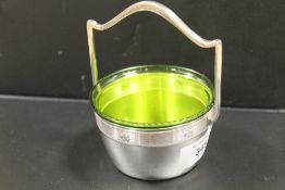 A SILVER PLATED GLASS LINED SUGAR BASKET