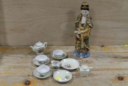 A MINIATURE JAPANESE TEA SERVICE TOGETHER WITH A GILDED ORIENTAL FIGURE