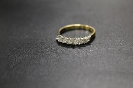 A HALLMARKED 18CT SEVEN STONE MARQUISE DIAMOND RING SET WITH AND ESTIMATED 1/3 OF A CARAT OF